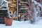 Rustic fire wood shed and basket in winter garden