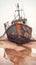 Rustic fishing boat stranded on sandy shore, a relic of seafaring days