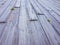 rustic floor of light woods that fill the whole image. Picture taken on the beach of Benidorm, Spain