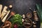 Rustic food background with parsley root vegetables, herbs,spices ,leek and champignon mushrooms on dark rustic table with kitchen