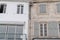 Rustic French building facade white wall and stone facades