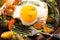 Rustic fried egg and vegetables close-up