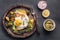 Rustic fried egg and vegetables with fork