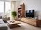 Rustic furniture and tv wooden shelving unit in bright room. Scandinavian interior design of modern living room