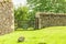 Rustic gate in drystone wall in Bibury England UK.