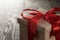 Rustic gift box with red ribbon bow