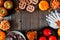 Rustic Halloween treat frame overhead on a dark wood background
