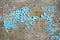 Rustic hardboard texture with scratches, cracks and blue peeling paint. Grunge background