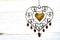 rustic heart shaped metal decoration hanging with white background