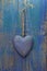 Rustic heart on turquoise/blue wooden surface for valentine, bir