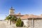 Rustic houses and the clock tower in Villaciervos village, Soria, Spain