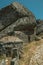 Rustic houses with stone wall inside big rock at Monsanto