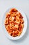 Rustic italian paccheri pasta in tomato sauce