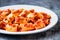 Rustic italian paccheri pasta in tomato sauce