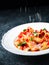 Rustic italian rigatoni pasta cheese grating motion blur