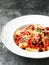 Rustic italian rigatoni pasta in tomato sauce