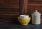 Rustic kitchen still life. vintage ceramic bowl and enameled jar