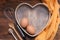 Rustic Kitchen Tools for Bakerry or cooking. Raw Eggs with wooden spooon, Orange Napkin, Heart Shape Box and Baking