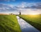 Rustic landscape with dutch windmills near the water canals