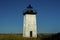 Rustic Lighthouse in Field