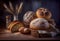 Rustic loaves of bread placed on black wooden background.