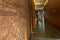 Rustic or loft style Brick wall corridor in a modern building.