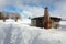 Rustic log shed or stable in rural countryside with full coverag