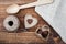 Rustic looking tabletop with wooden spoon, rope and paper and chocolate hearts