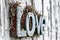 Rustic Love Sign on a Wooden Background