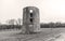 Rustic old abandoned brick farm silo standing in a field