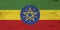 A rustic old Ethiopia flag on weathered wood