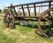 Rustic Old Horse Drawn Wagon with two young goats resting in his shadow