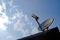 Rustic old parabolic satellite station and blue sky