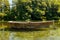 Rustic Old Wooden Boat on crystal clear waters of St. Naum Springs