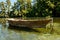 Rustic Old Wooden Boat on crystal clear waters of St. Naum Springs