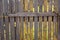 Rustic old wooden fence with rotten planks