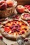 Rustic open pie with peach and raspberry