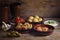 Rustic party appetizers such as baked olives, prawn shrimps, pot