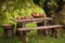 rustic picnic table with cider press and apples