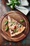 Rustic pizza with fresh basil leaves