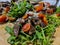 Rustic platter prepared for tourists with pork neck on wooden platter