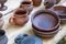 Rustic pottery clay traditional set cup and plate set counter at a village fair