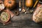 Rustic pumpkins with bread and seeds on wood