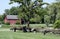 Rustic red barn with a split rail fence