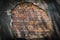 Rustic red corroded brick hole in plaster wall with light and shadow patterns