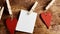 Rustic red hearts and blank note on a string