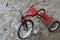 Rustic Red Tricycle Covered in Ice