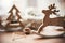 Rustic reindeer christmas toy on wooden table on background of w