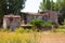 Rustic residential ruin abandoned in a green landscape in a Tuscan field