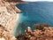 Rustic rocks form a natural wall around KaputaÅŸ Beach in Turkey